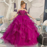 A girl wears a magenta off-shoulder ball gown with a sweetheart neckline and ruffled tulle skirt.