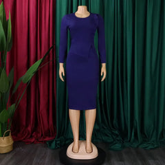 A long-sleeved, royal blue sheath dress with a round neckline and a ruffled waist detail.