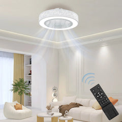 A white flush mount ceiling fan with a decorative light ring and a remote control.