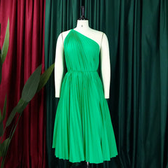 Women’s one-shoulder sleeveless pleated knee-length swing dress by Showlu Fashion, stylish and chic for 2023 fashion trends.