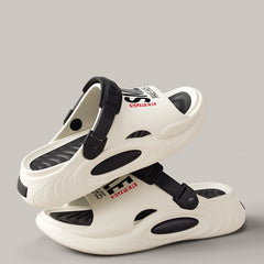 A pair of white and black EVA slides with thick soles and adjustable heel straps.