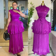 A sleeveless purple pleated midi dress with a ruffled peplum waist and a matching fabric belt.