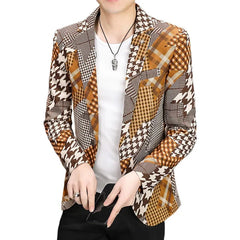 A man wears a slim-fit blazer featuring a patchwork of brown and white houndstooth and plaid patterns.
