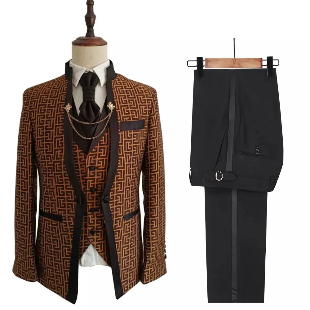 A three-piece men's suit featuring a patterned brown blazer, vest, and solid black trousers.