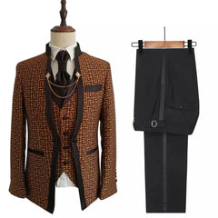 A three-piece men's suit featuring a patterned brown blazer, vest, and solid black trousers.
