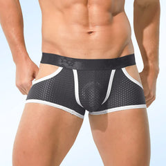 A man wears grey mesh boxer shorts with white trim and a black waistband.