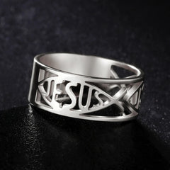 A silver-colored stainless steel ring featuring a cutout design of the word Jesus and fish symbols.