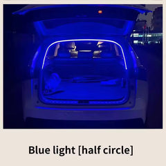 A blue LED light strip installed in a car trunk, creating a glowing half-circle effect.