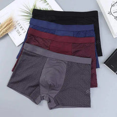 A stack of four men's breathable mesh boxer shorts in black, blue, maroon, and grey.