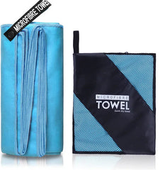 A blue microfiber sports towel shown unfolded next to its folded carrying pouch.