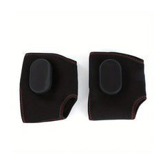 A pair of black rechargeable ankle massagers with red stitching and a smooth control panel.