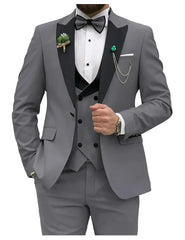 A grey slim-fit three-piece tuxedo suit featuring a black peak lapel, vest, and bow tie.