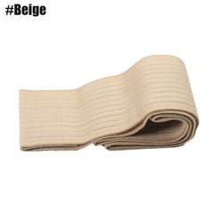 A beige elastic compression bandage is folded into a stack.