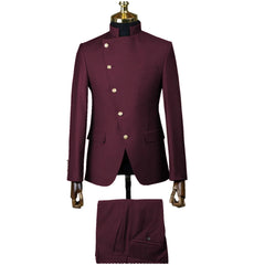 A burgundy two-piece men's suit featuring a stand collar jacket with an asymmetrical button front.