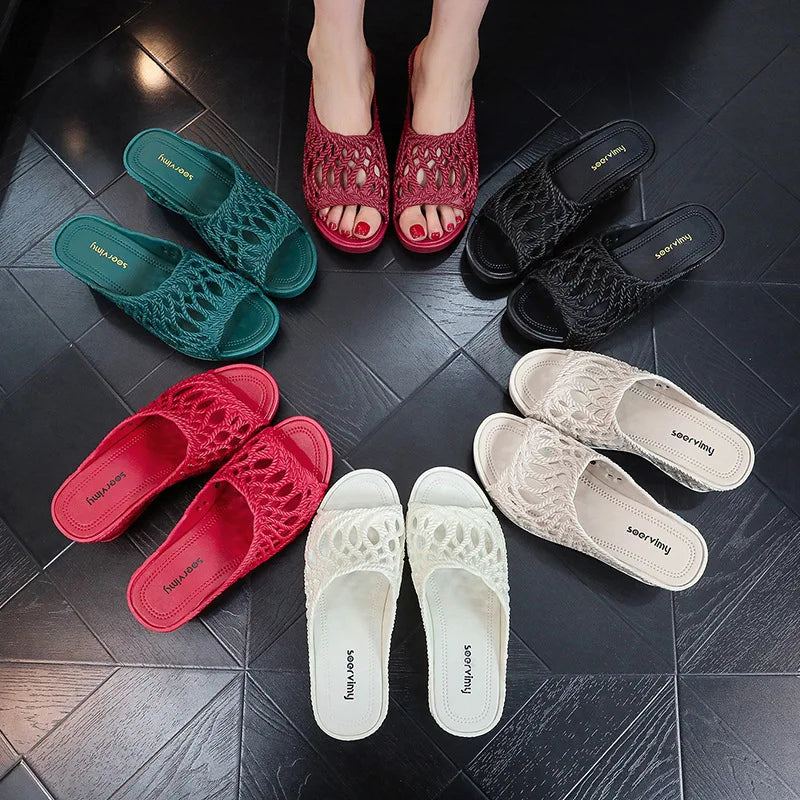 A collection of women's wedge slippers with hollow-out peep toes in various colors.