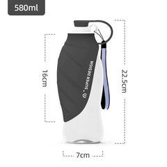 A portable 580ml pet water bottle with a grey silicone sleeve and a carrying strap.