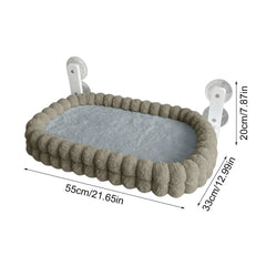A plush, oval-shaped cat window hammock with suction cup mounts and labeled dimensions.