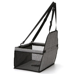 A grey foldable pet car seat with mesh sides and adjustable straps for secure travel.