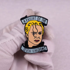 A metal enamel pin featuring a portrait of Brienne of Tarth with the text A Knight of the Seven Kingdoms.