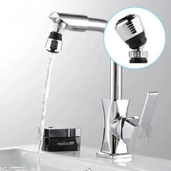 A chrome swivel faucet aerator attached to a kitchen tap with a water stream flowing.