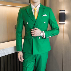 A man wears a slim-fit green double-breasted suit with a white shirt and yellow tie.