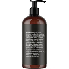 A brown pump bottle of M3 Naturals massage oil with a black label listing ingredients.