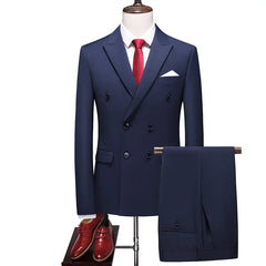 A blue double-breasted men's suit with a white shirt, red tie, and matching dress shoes.