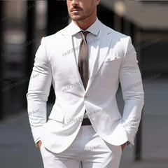 A man wears a white two-piece suit with a brown tie for a formal occasion.