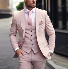 A man wears a light pink three-piece suit consisting of a jacket, vest, and trousers.