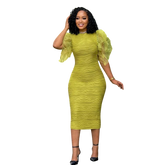 A woman wears a lime green, mid-calf bodycon dress with ruffled butterfly sleeves and a textured finish.