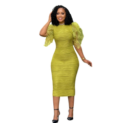 A woman wears a lime green, mid-calf bodycon dress with ruffled butterfly sleeves and a textured finish.