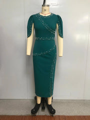 A dark green ankle-length sheath dress with short sleeves, a round neckline, and pearl bead accents.