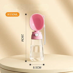 A portable pink pet water bottle with an integrated drinking bowl and a carrying strap.