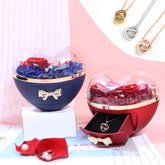 Two heart-shaped jewelry boxes with preserved flowers and a matching necklace.