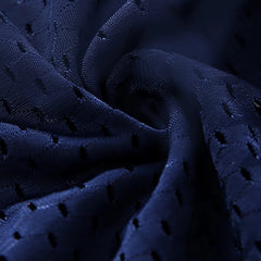 A close-up view of dark blue, breathable mesh fabric used for men's underwear.