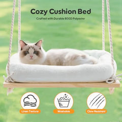 A cat rests on a plush white cushion placed on a wooden hanging swing bed.