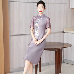 A woman wears a purple satin cheongsam with lace sleeves, floral embroidery, and beaded accents.