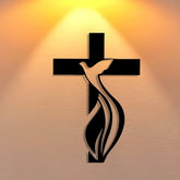 A minimalist black metal wall art piece featuring a dove silhouette integrated with a cross.