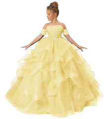 A young girl wears a yellow off-shoulder ball gown with lace appliques and a ruffled tulle skirt.