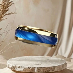An 8mm gold-tone stainless steel ring featuring a polished blue marbled inlay.