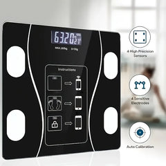 A black digital body scale with a backlit LED display and four metallic sensor pads.