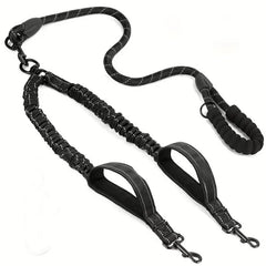 A black reflective dual dog leash with two traffic handles and a padded foam grip.