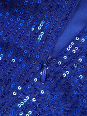 A close-up view of a royal blue sequined dress featuring a concealed zipper closure.