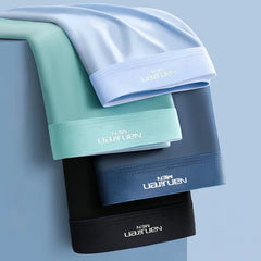 A stack of four men's ice silk boxer shorts in light blue, mint green, dark blue, and black.