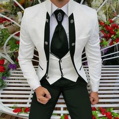 A man wears a white patterned tuxedo jacket with black trim, a white vest, and black trousers.
