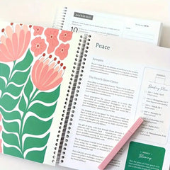 A spiral-bound Bible study journal open to a page about peace with floral illustrations.