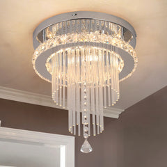 A modern flush-mount crystal chandelier with a polished chrome frame and cascading glass rods.
