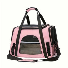 A pink soft-sided pet carrier bag with black mesh windows and carrying straps.