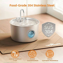 A stainless steel pet water fountain sits on a mat with icons highlighting its material safety.