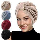 A woman wears a beige sequined knotted turban, with four color options displayed on the left.